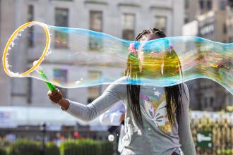 Girl creates an enormous bubble