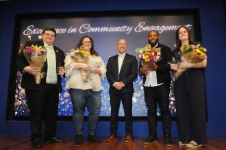 Mantell (center) honors Community Engagement Award winners (left to right) paraprofessional John Kamps of IS 5 in Elmhurst, Queens, teachers Karen Hershkowitz of JHS 227 in Bensonhurt, Brooklyn, and Kyle Goodridge of  IS 217 in Longwood, the Bronx, and Chapter Leader Kristin Golat-Defendis of IS 51 in Park Slope, Brooklyn.