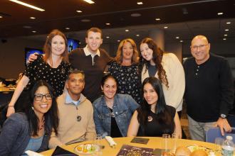 Collaboration Award winner Spenser Scherling of IS 136 in Brooklyn’s Sunset Park celebrates with colleagues and family.