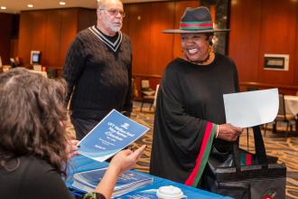 A retired teacher checks in at the UFT New Retiree Luncheon on Dec. 5, 2024. 