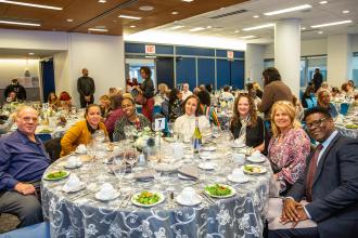 New retirees from District 27 in Queens enjoy the luncheon together.