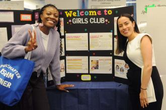 Speech teachers Sally Trye (left) and Angelica Penagos Bolivar of P277 @ PS 322, a District 75 program in Queens, display their award-winning project, “Girls Club.”