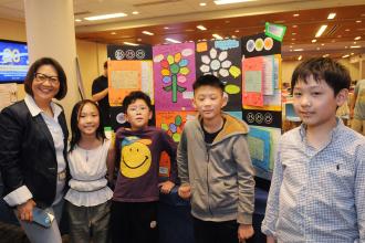 Connie Cai, a speech teacher at PS 42 in Manhattan, shows off her students’ project, “Lunch from Home.”