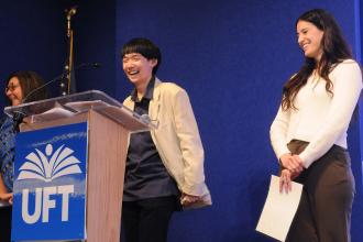 Speech teacher Maria Barbagianis of Forest Hills HS and her student accept their award for “How Stuttering Has Impacted Me.”