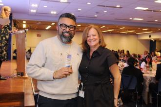  Gary Mehra, special education project manager, shows off his Friend of the Chapter award with UFT Vice President for Special Education MaryJo Ginese.