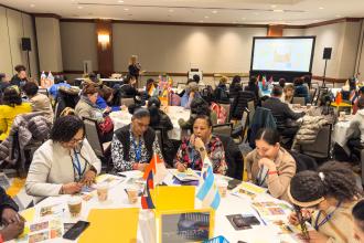 Paraprofessionals complete an activity in a workshop about visual aids to support English language learners at the 2025 UFT Paraprofessionals Awards Luncheon on March 22, 2025. 