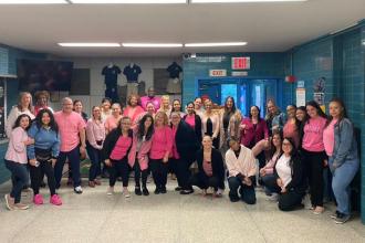 Teachers pose for Pink Day