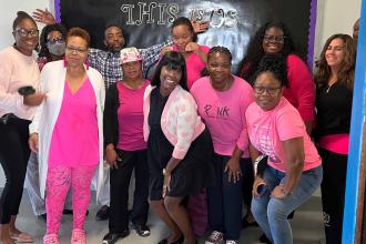 Teachers pose for Pink Day