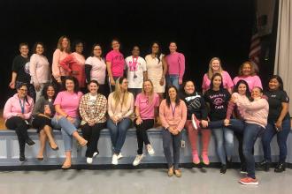 Teachers pose for Pink Day