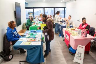 Attendees check out the resource fair to learn about the UFT’s homework helpline, Dial-A-Teacher, and BRAVE, the union’s anti-bullying initiative, as well as those from other vendors and community groups.