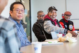 Attendees engage during a Men’s Roundtable Discussion on neurodiversity in children.