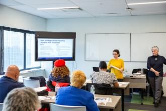 Attendees listen during a summit presentation on laws and regulations impacting students with disabilities at the UFT Queens Power Summit on Nov. 23, 2024. 