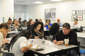 School counselors take notes at the 2025 UFT School Counselors Conference