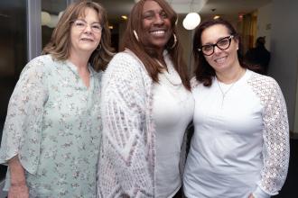 Three women from the UFT School Nurses Executive Committee take a photo during the UFT's School Nurses Appreciation Dinner on May 7, 2025.