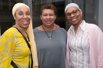 Three women take a photo during the UFT School Nurses Appreciation Dinner on May 7, 2025.