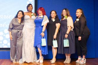 Bronx honorees share a laugh onstage with Chapter Leader Sheryl Pender at the UFT School Secretary Awards Soiree on June 6, 2025. 