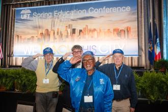 Members of the UFT Veterans Committee salute the day at the 2025 UFT Spring Education Conference