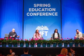 A stage shot of the town hall taking place at the 2026 UFT Spring Conference on May 16, 2026. 