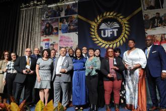 Congratulating Marsh/Raimo Award winners Dina Barghouti, Vernetta Crowner-Deshommes, Avi Gvili, James Rodriguez, Genoveba Smith and Winnie Thompson for their political activism are union leaders including UFT Political Director Vanecia Wilson (center), Mulgrew (fourth left) and Barr (right).