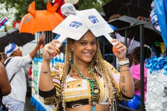 Woman holding two UFT signs