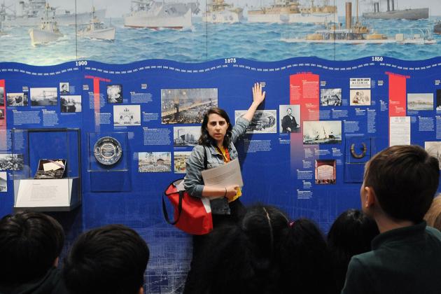 Museum educator Rebecca Saltzman and students discuss historical developments at