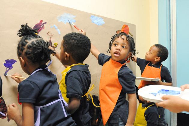 Prekindergartners create a mural based on the story “Maybe Something Beautiful.”