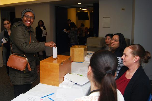 Marie Ledain (left), a nurse in Brooklyn, casts her vote for the new Visiting Nu