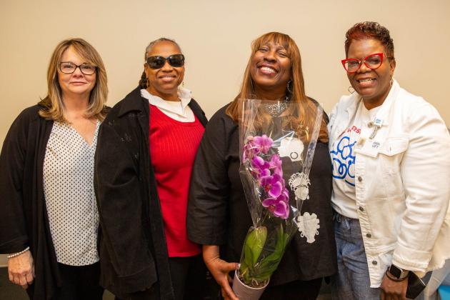 Four women pose for a photo 