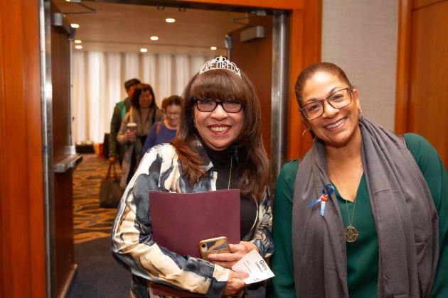 Two women smile for a photo