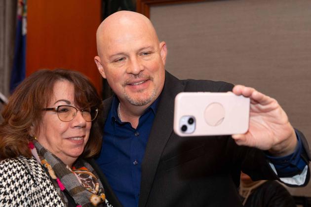 A man and a woman take a selfie