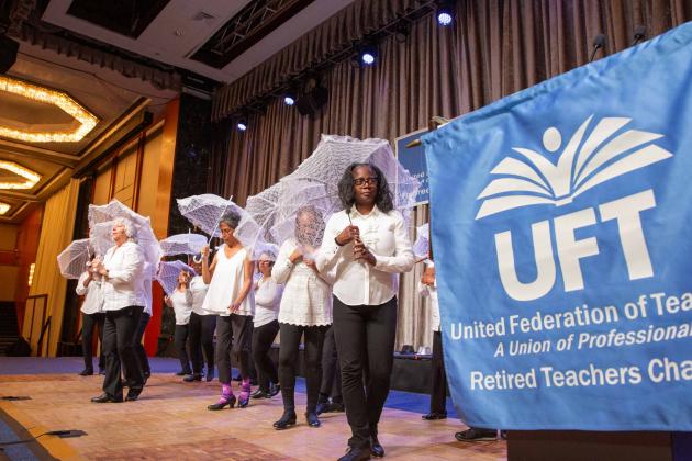 A group of tap dancers perform on stage 