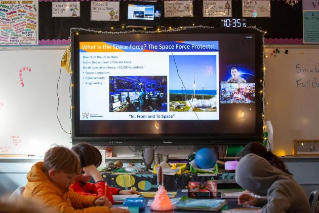 Students in Stephen Kos' science class at Manhattan's MS 245 engage in a virtual visit by technical sergeant with the U.S. Space Force. 