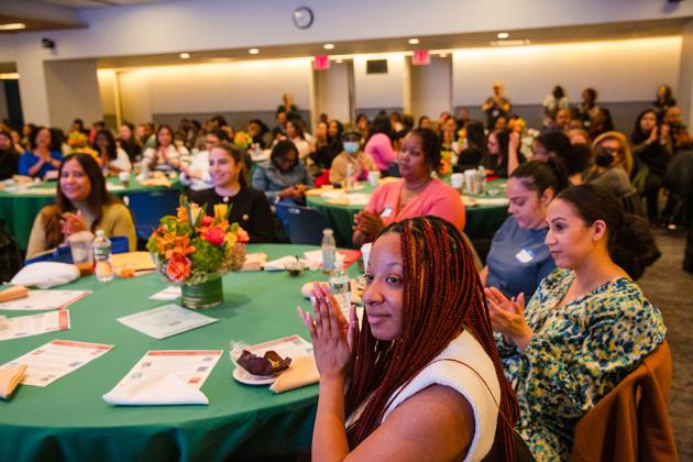 Conference attendees applaud the opening speaker of the 2024 UFT School Counselors Conference