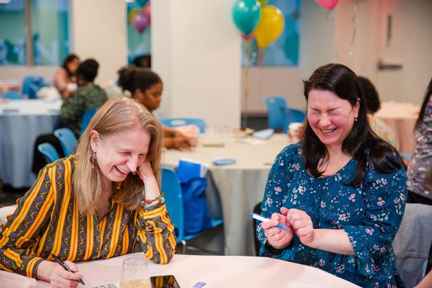 Two school nurses share a laugh at the 2024 UFT School Nurses Appreciation Dinner on May 8, 2024