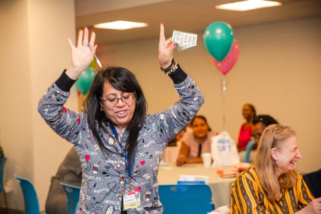 A school nurse in attendance at the UFT School Nurses Appreciation Dinner on May 8, 2024 celebrated after winning Bingo. 