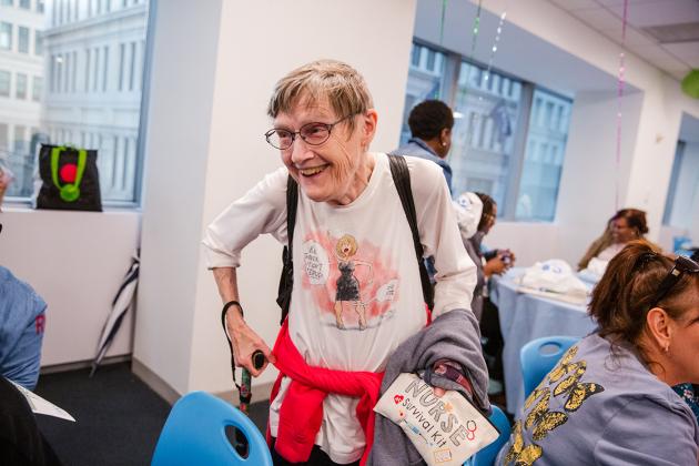 School nurse Noelle Nightingale smiles as she interacts with guests at the 2024 UFT School Nurse Appreciation Dinner