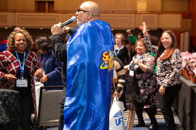 A paraprofessional performs for fellow attendees at the 2024 UFT Paraprofessional Festival and Awards Luncheon. 