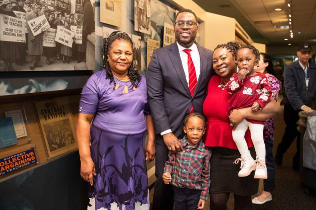 An honoree poses with his family.