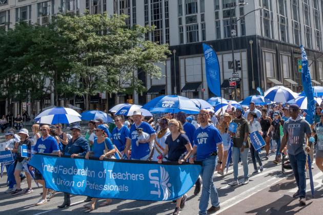 A group of union members march in the street of New York City for the 2022 Labor Day Parade 