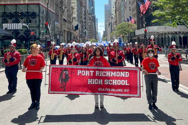 The Port Richmond HS school band marches down the street at the 2022 Labor Day Parade