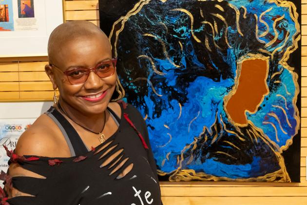 Angela Denise shows off her piece titled "Regal Beauty" at the New York City Art Teachers Association/UFT’s Dreams Art Show on May 10, 2024.