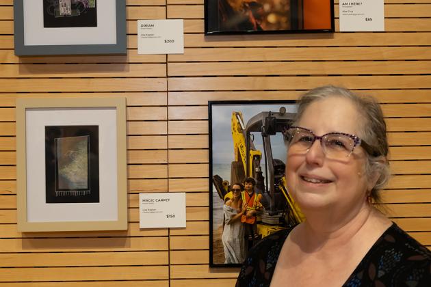 Lisa Kaplan takes a photo in front of her art pieces at the New York City Art Teachers Association/UFT’s Dreams Art Show on May 10, 2024. 