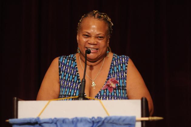 A woman speaks at the podium at the 2024 UFT Retired Teachers Chapter Luncheon