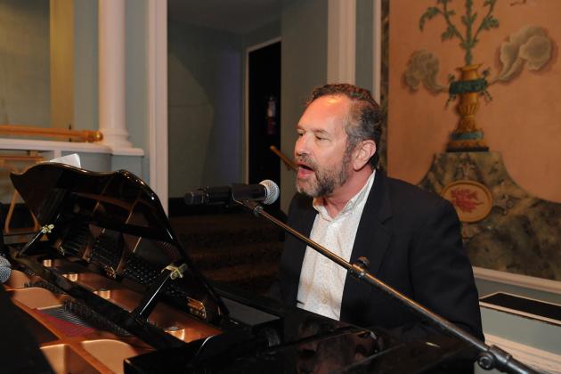 A retiree sings and plays the piano at the 2024 UFT Retired Teachers Chapter Luncheon.
