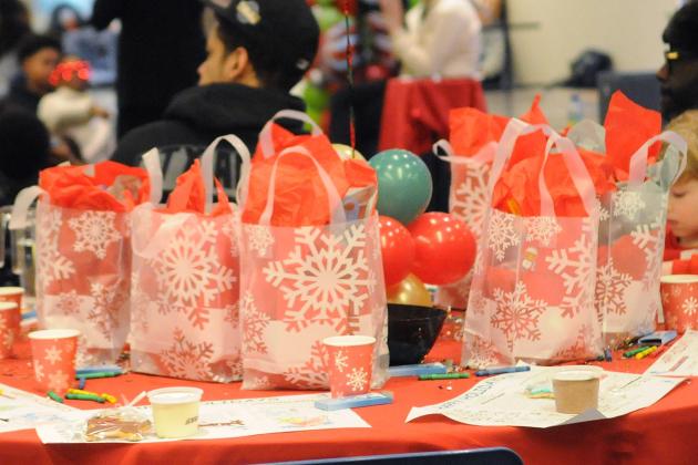 Gift bags filled with stocking-stuffer treats, such as plush toys, socks and toy cars, greet students arriving to the UFT/Coalition for the Homeless holiday toy drive and celebration on Dec. 7, 2024. 