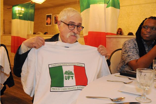 A man shows off his UFT Italian-American heritage committee t-shirt