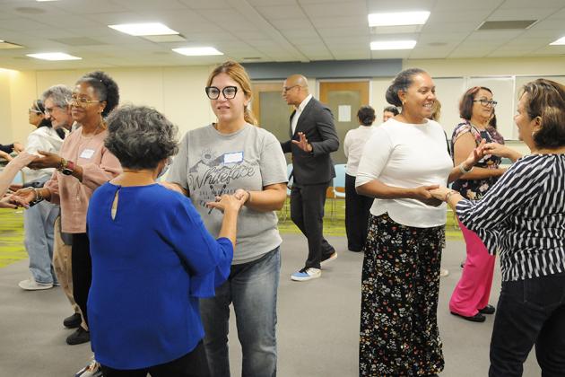 Attendees at the NYC Association of Foreign Language Teachers/UFT annual fall conference learn new dance steps in a workshop. 