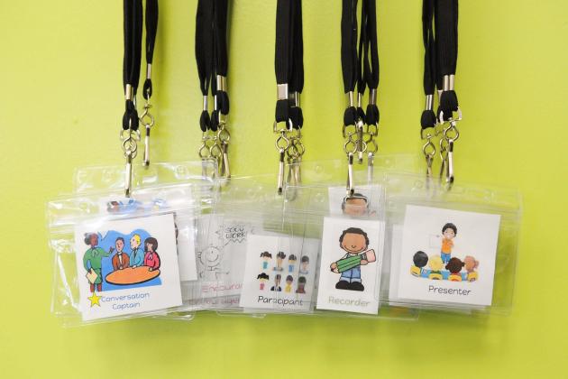 Lanyards hanging from a wall