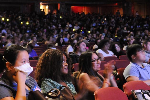 A crowd of members in a theatre 
