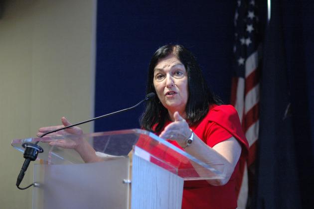 UFT Vice President Anne Goldman speaks at the podium